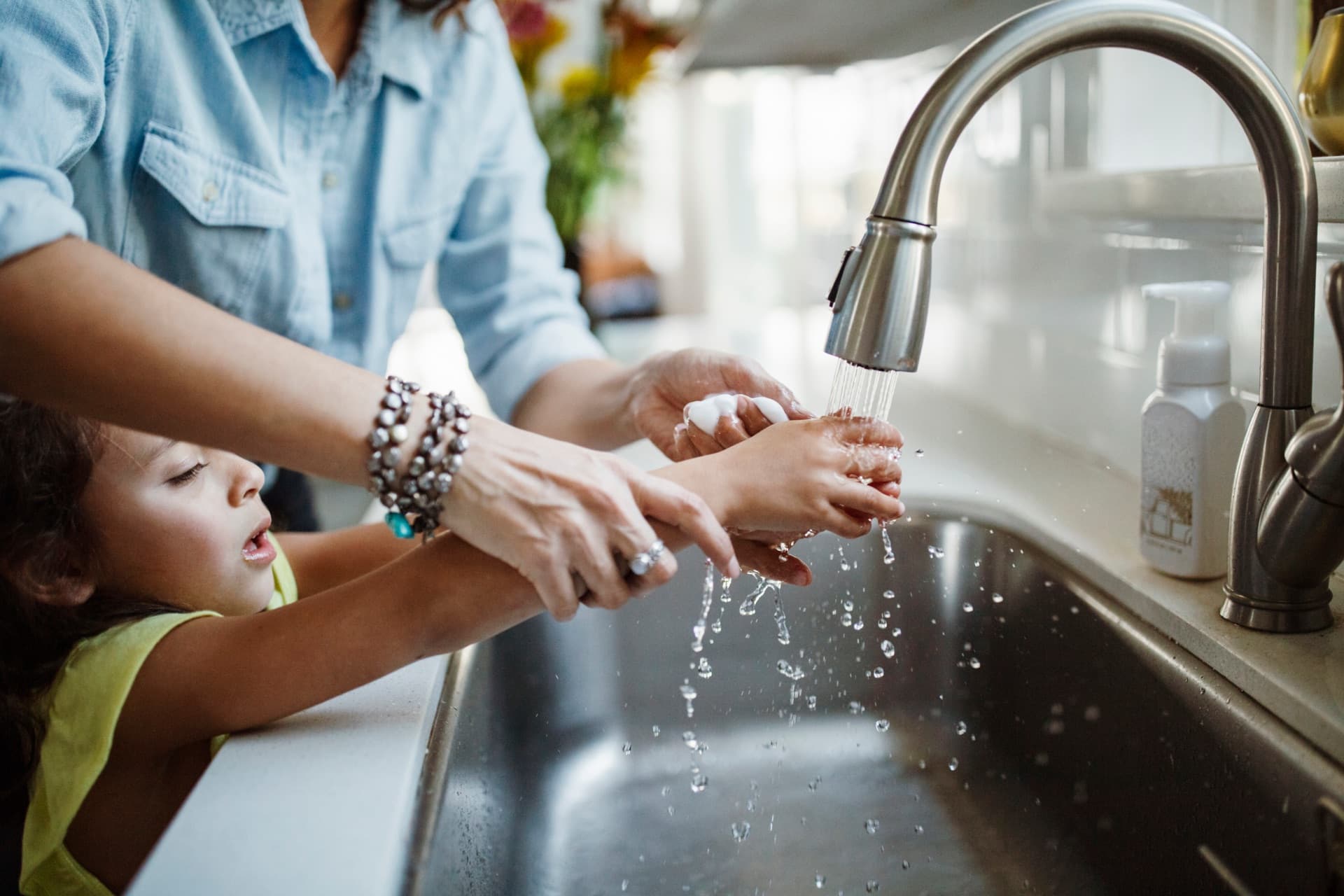 Mother and child using clean water