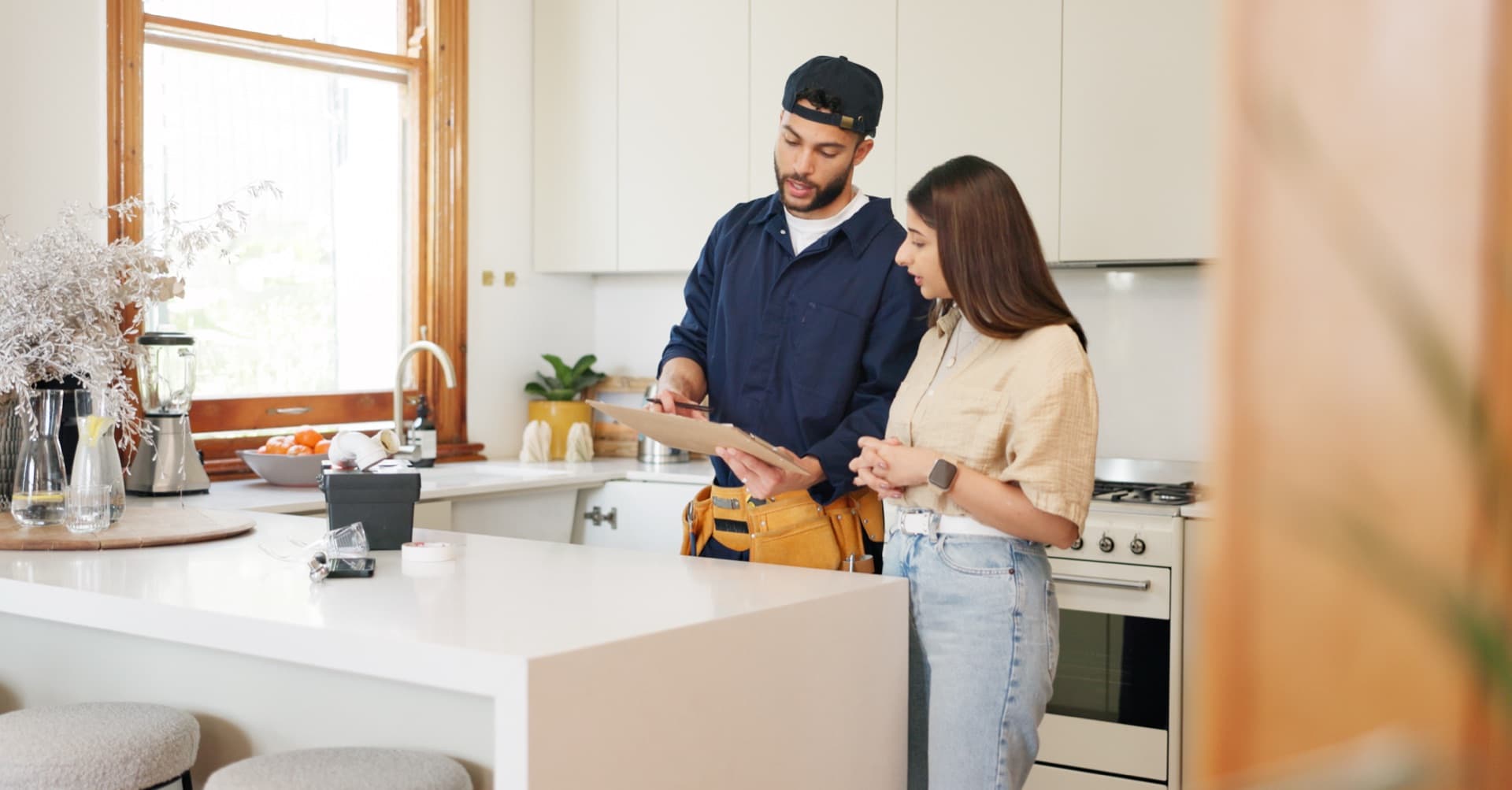 UpTown Cares team member consulting with homeowner